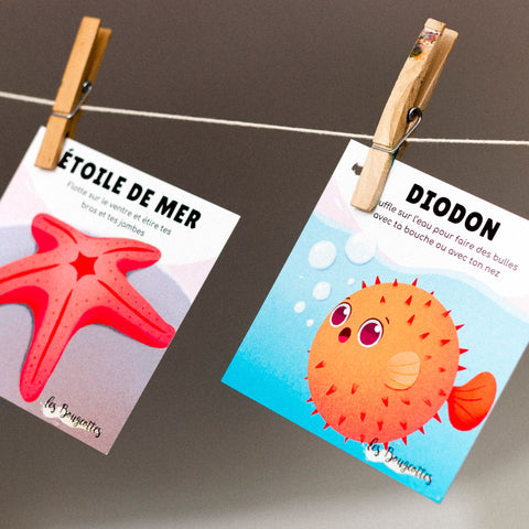 Cartes d’apprentissage bilingues sous l’océan (étoile de mer, diodon) dès 2 ans avec activité ludique sur corde.