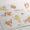Feuille d’autocollants mascotte Les Bougeottes (renard et kangourou) en plusieurs positions de gymnastique.