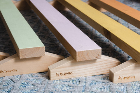 poutre de gymnastique pour enfant en bois de différente couleur : vert, rose, jaune, orange